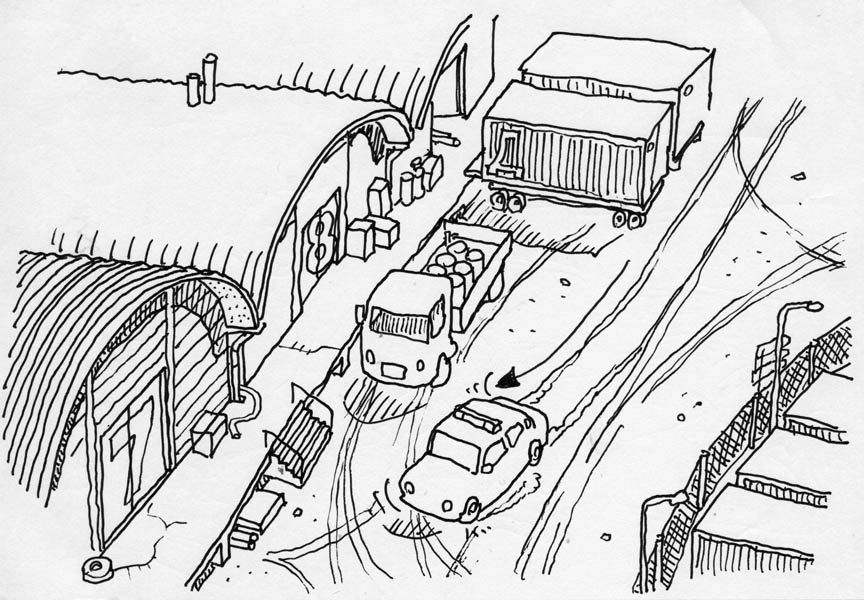 The car stops in front of warehouses.