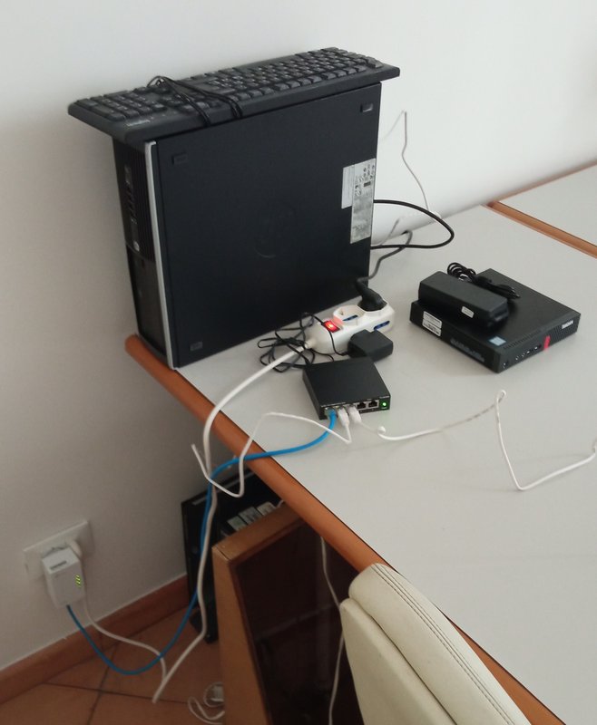 A small desktop, a tiny one, a switch and a net extender
